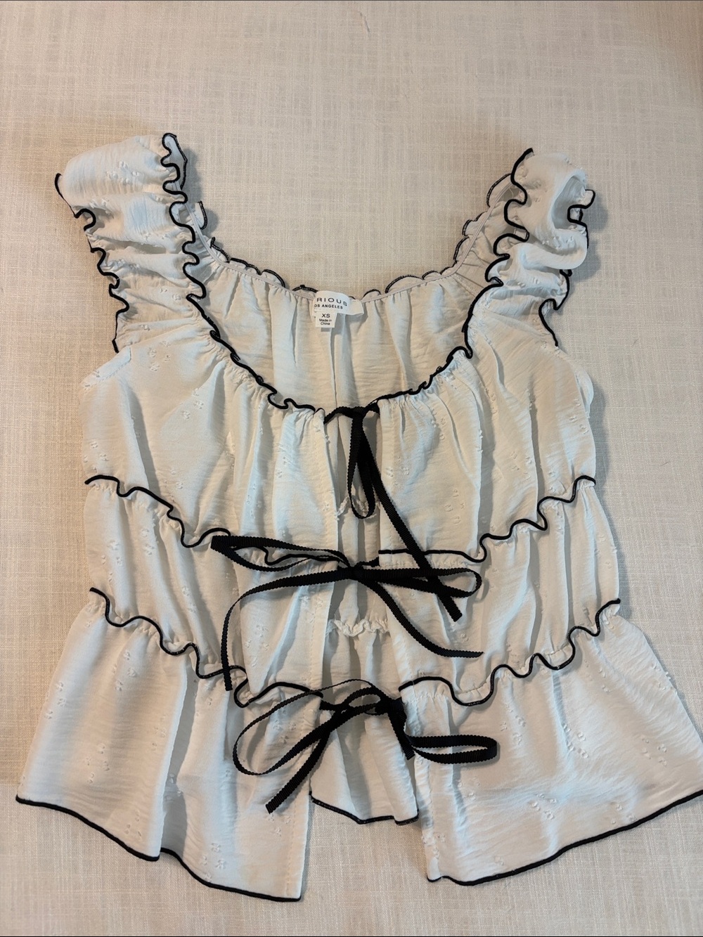 Ruffled Tie-Front Tank Top in White with Black Trim